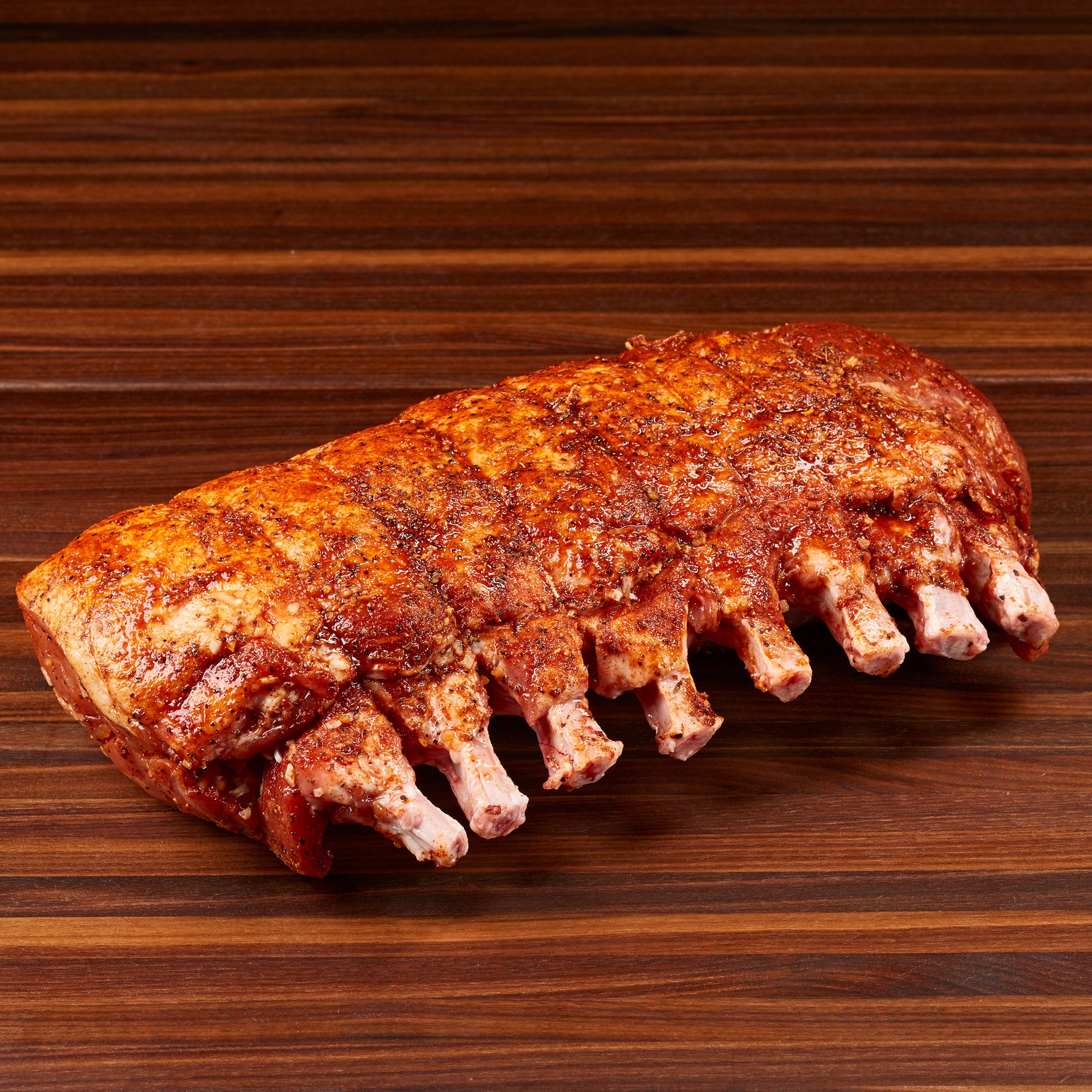 SEASONED RACK OF PORK PER LB